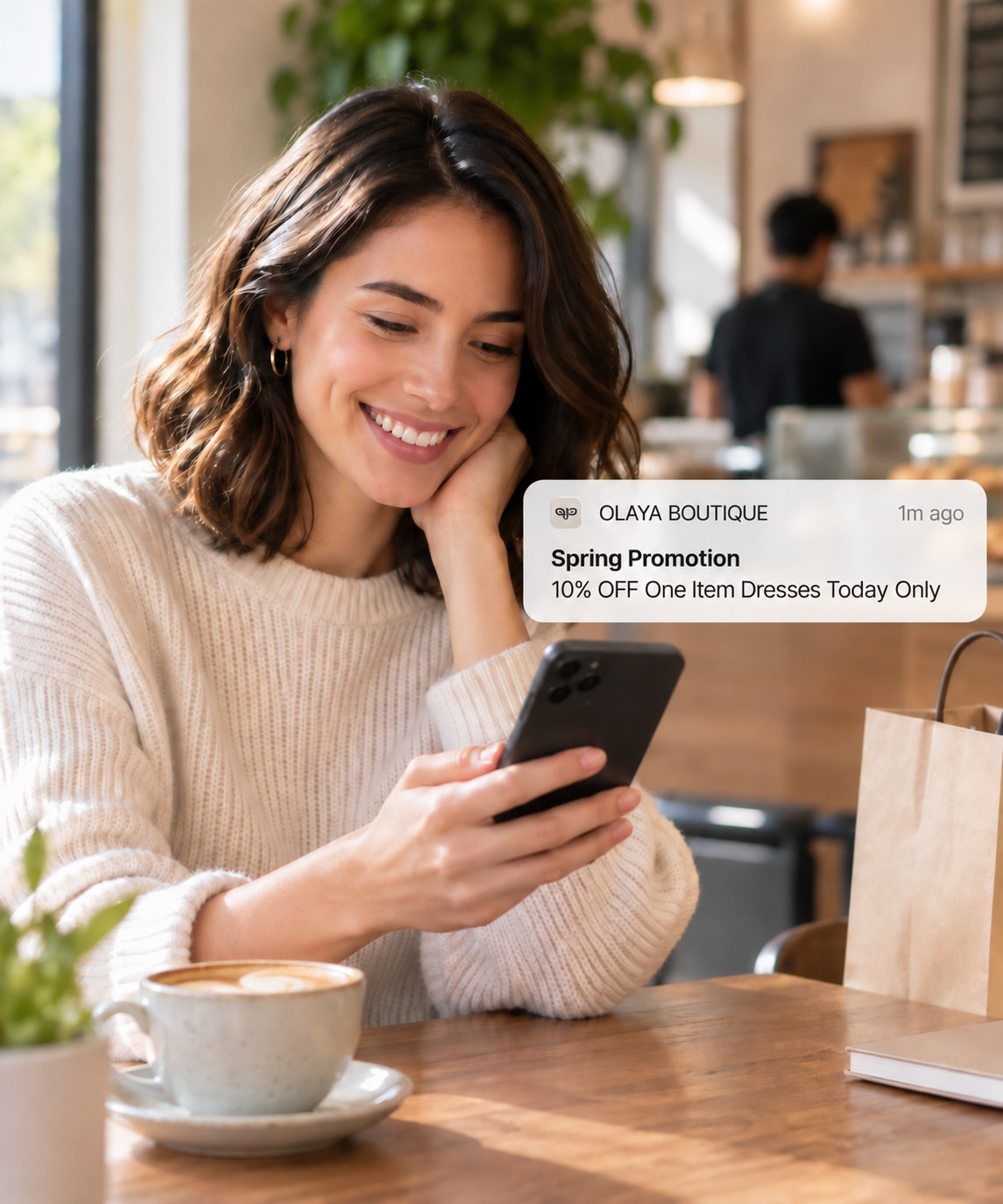 A customer reading a push notification over coffee